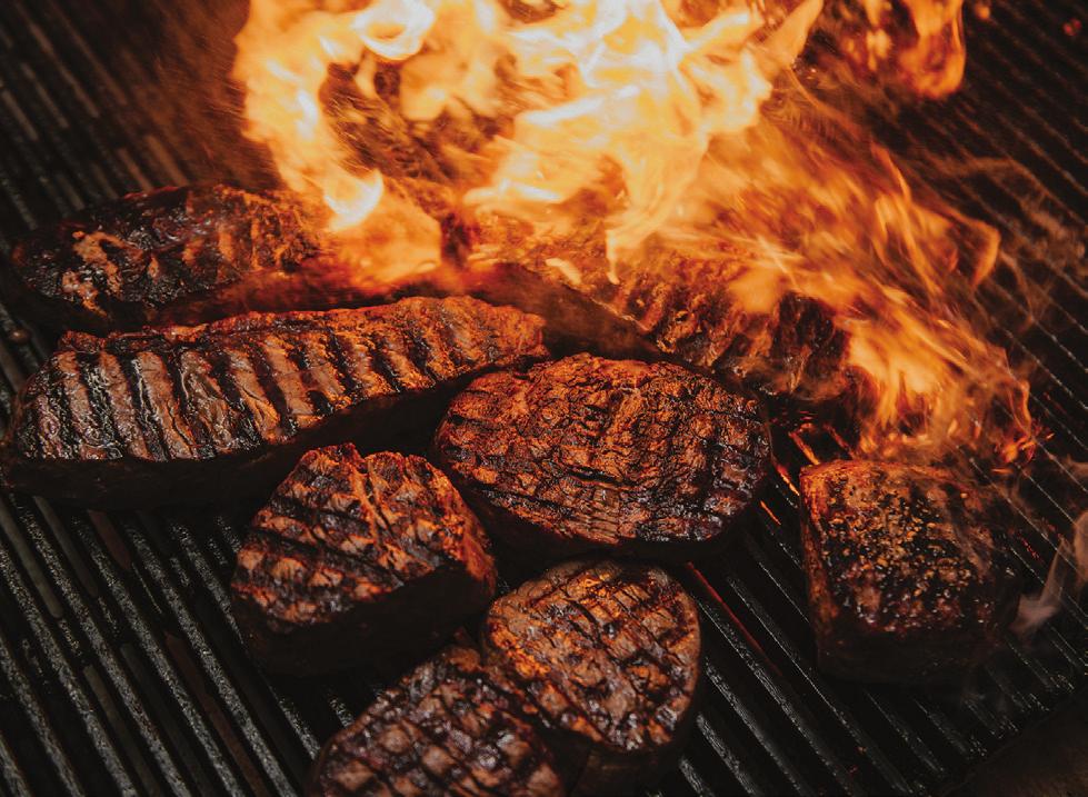Succulent steaks on the grill at Firegrill