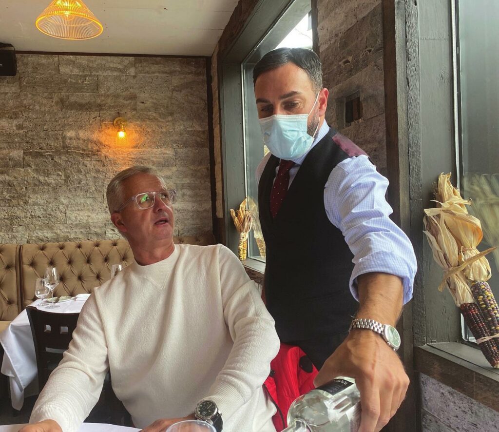 Donato Palazzo serves owner Ted Dranias at Osteria Pollino.