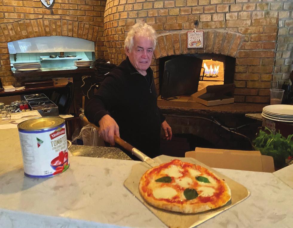 La Molisana owner Mike Cianciullo makes a pizza
