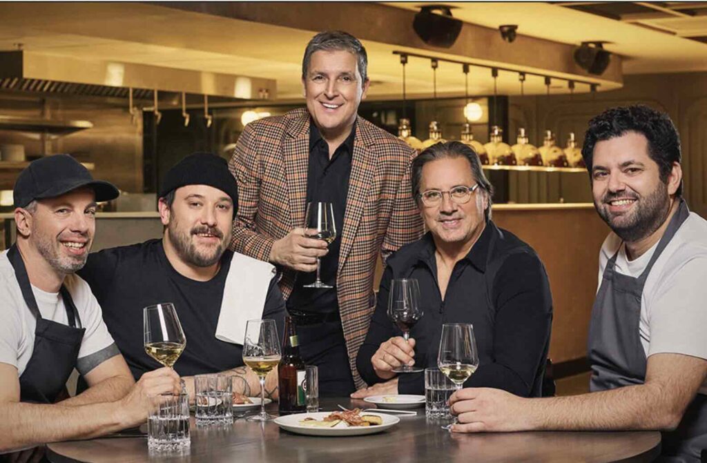 Owner Jean Pilote (standing, centre) and his team of chefs