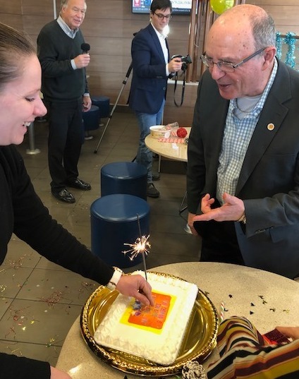 Harold is surprised by a cake.